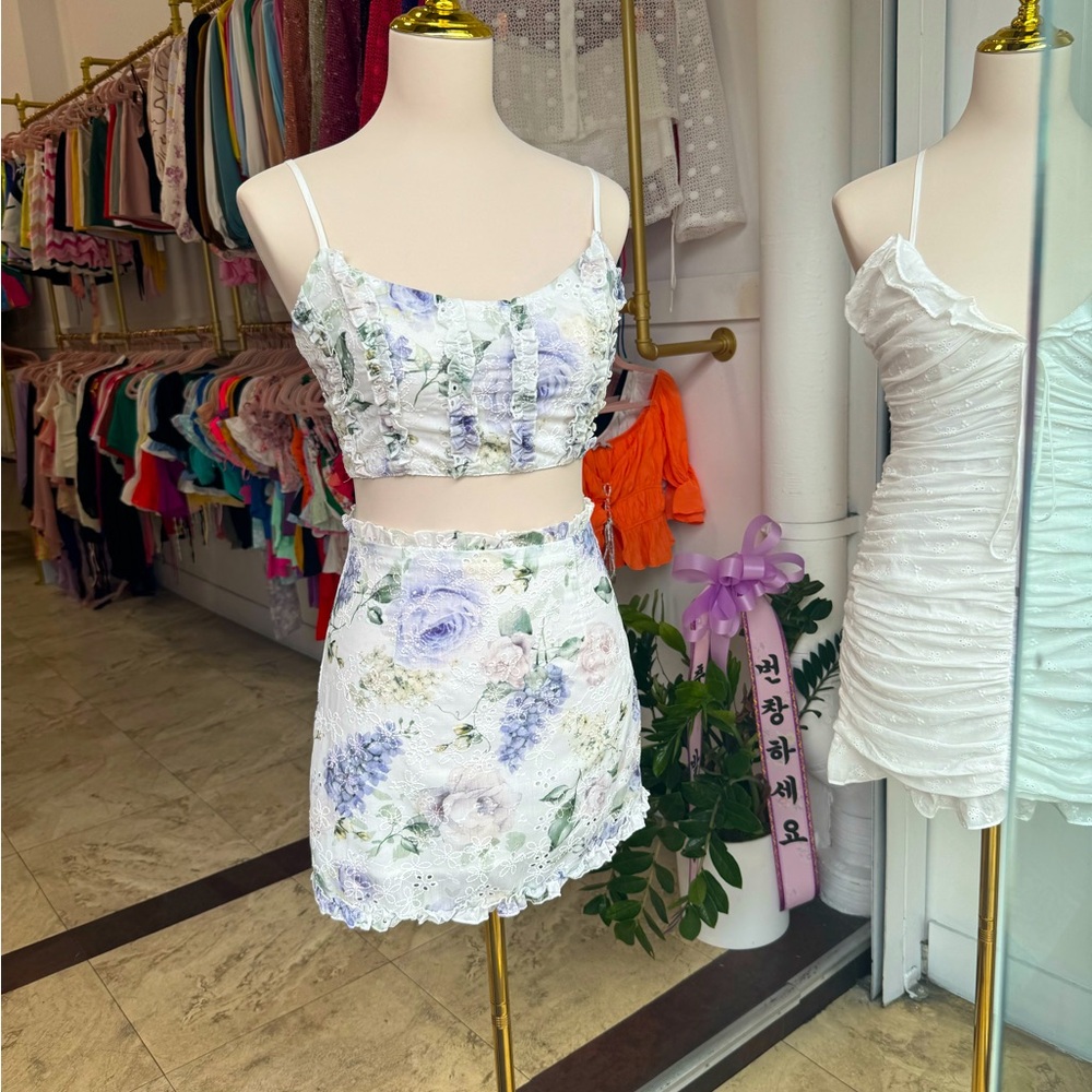 2 piece white eyelet with purple floral print mini skirt and top.